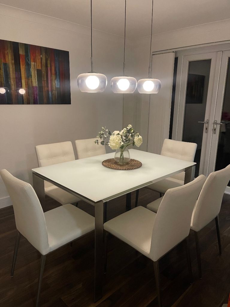 image for Dining table and chairs