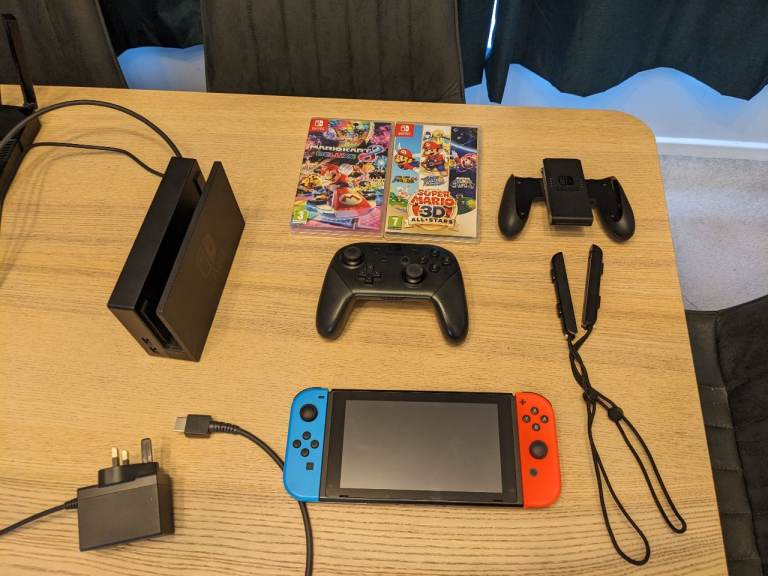 Nintendo Switch Console 64GB with Games and Accessories – Good Condition
