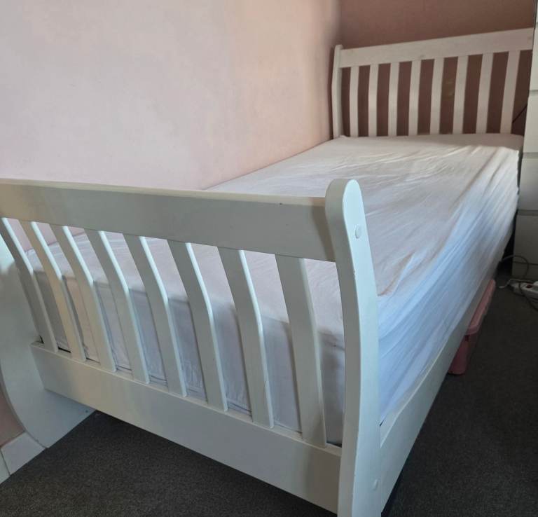 Single white bed frame and mattress