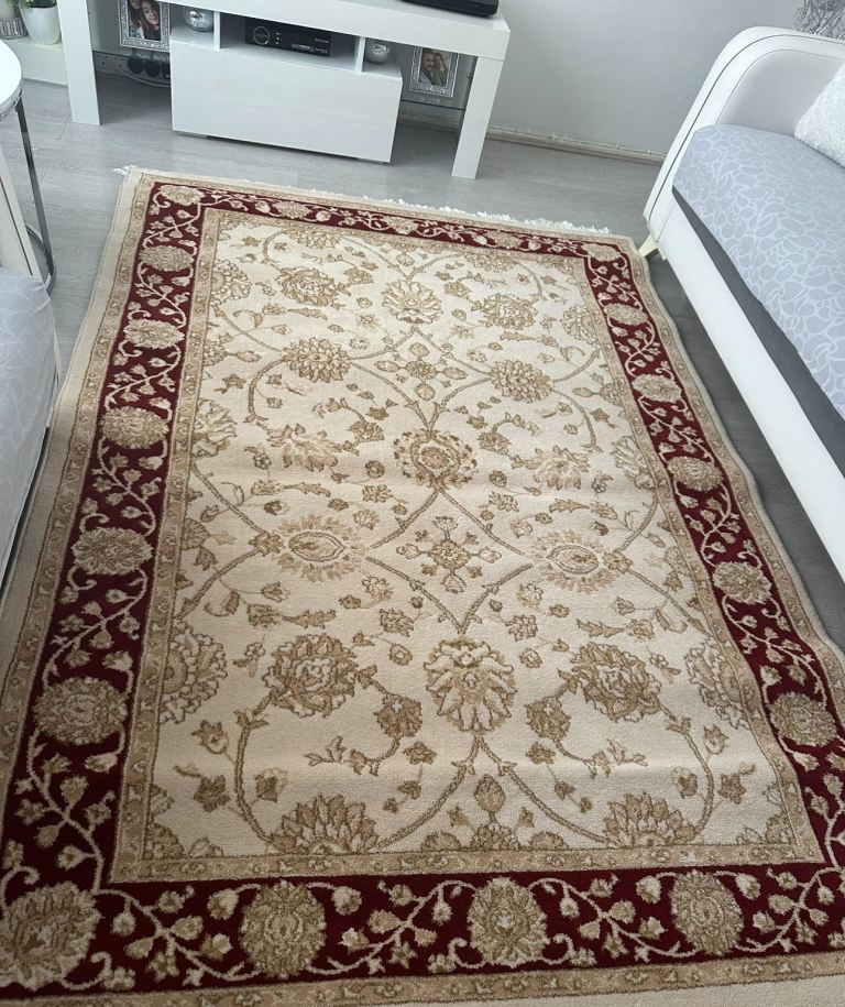 Cream and red rug 