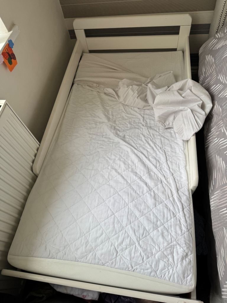 Toddler bed with mattress . Hardly used 