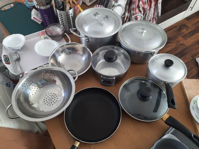 4 Cooking Pots, 2 Frying Pans, 3 Stainless Oval Dishes, 1 Stainless Drainer