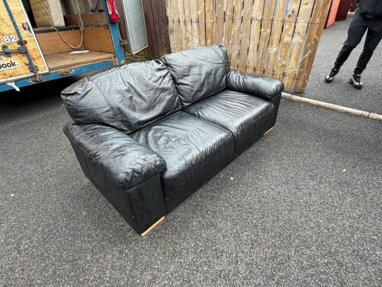 Big 2 seater sofa in a black leather   £125