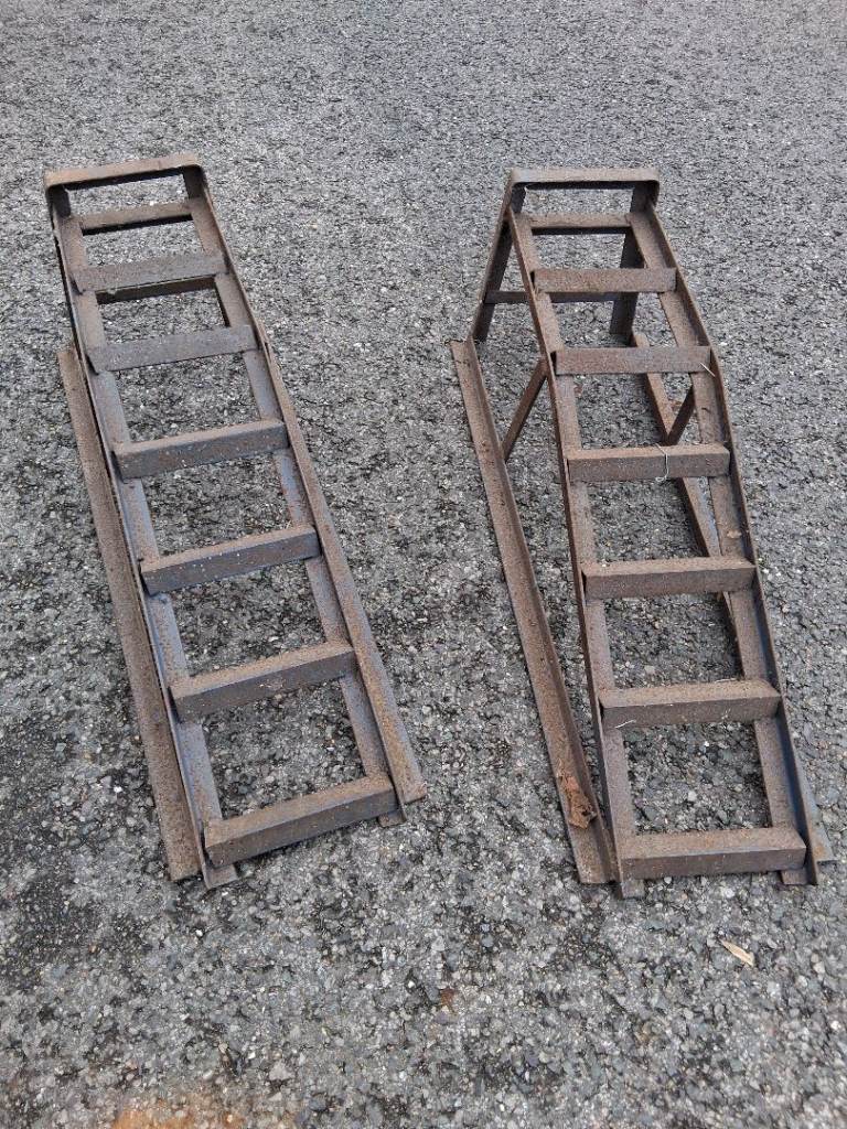 pair of steel car service ramps (also known as vehicle inspection or drive-on ramps