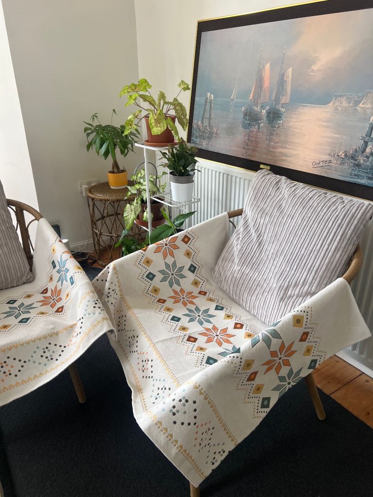 2 bamboo chairs and a table