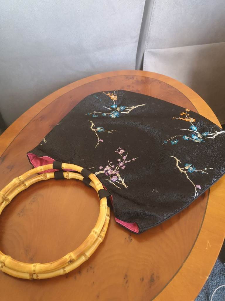 chinese silk embroidered bamboo effect handled bag