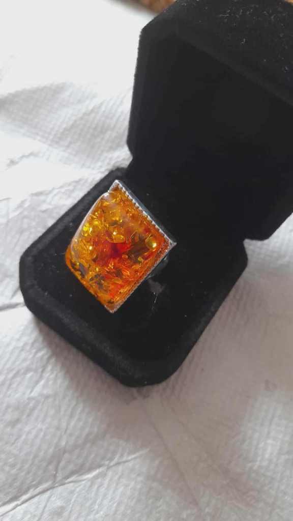 Imitation opal ring in black velvet box
