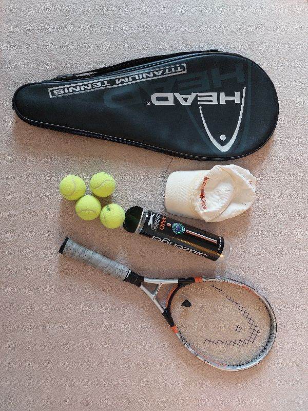 Tennis racquet with equipment