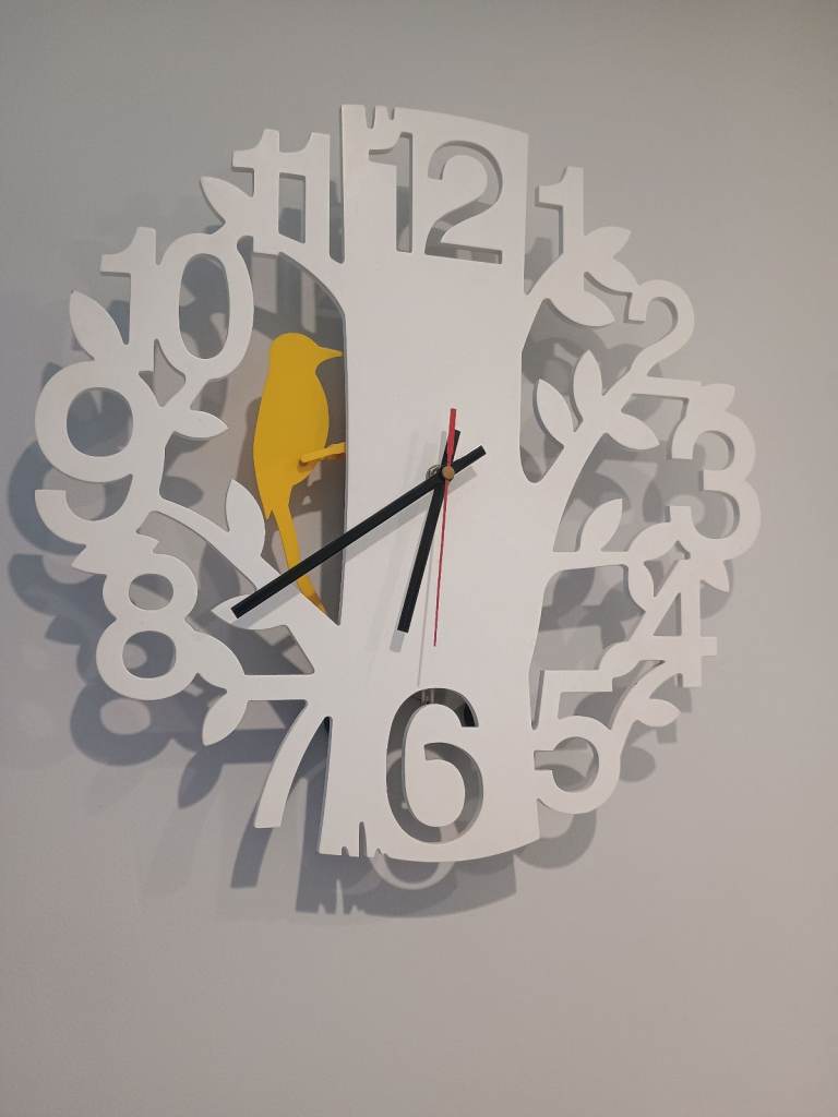 JOHN LEWIS QUARTZ CLOCK FEATURING SWINGING BIRD. 