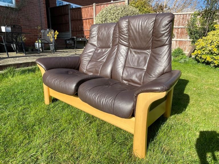 Stressless brown leather sofa, armchair and footrest.