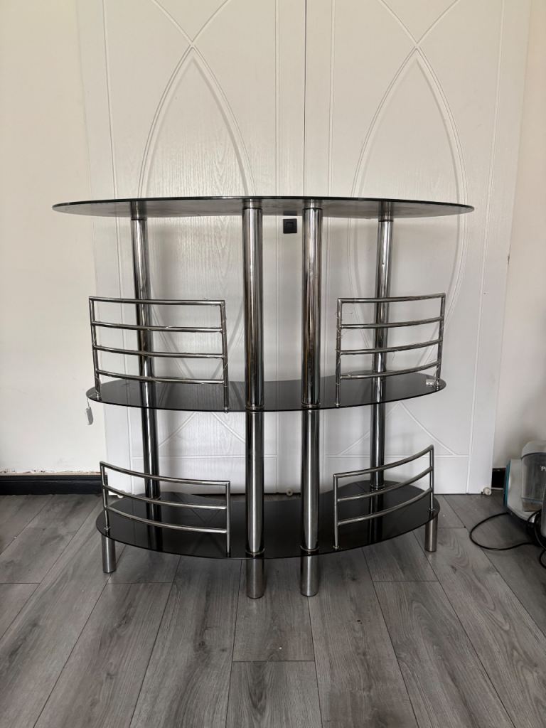 Home bar set up with fridge and bar table 