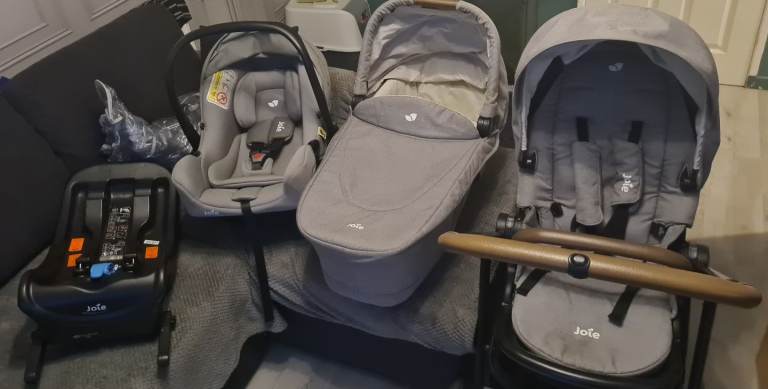 Joie travel system including car seat and isofix base.