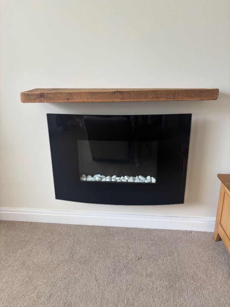 Modern electric fireplace and solid oak mantle
