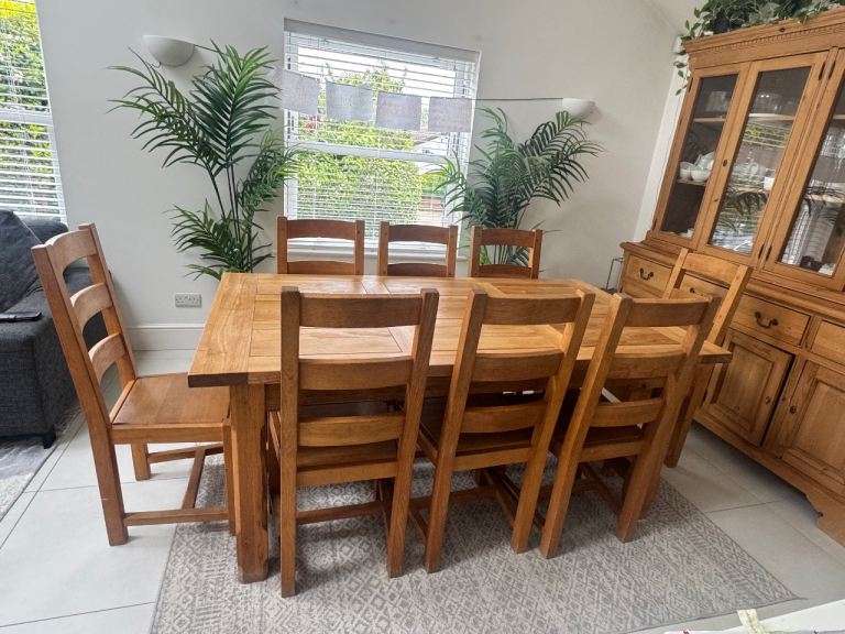 Solid wood dining table and 8 chairs