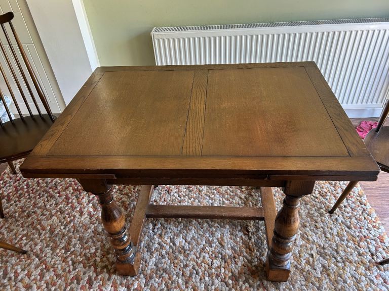 Extendable dinning table and 4 ercol chairs