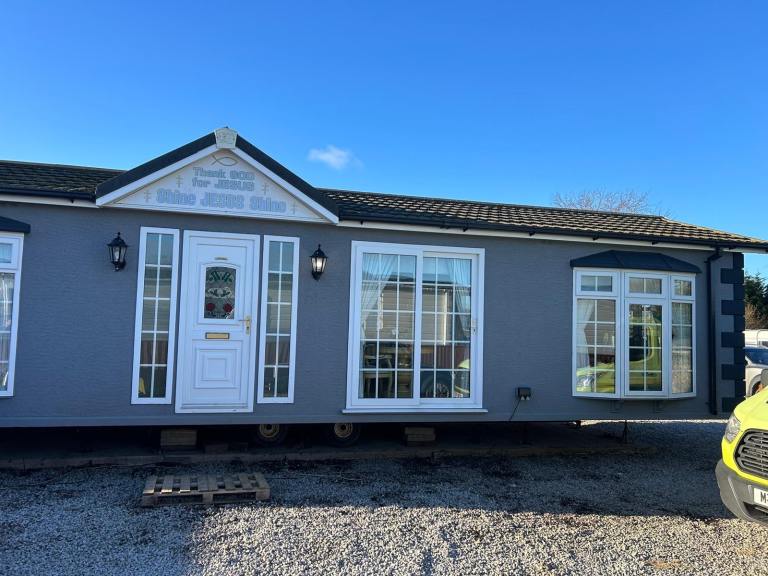 Stately Albion mobile home off site 