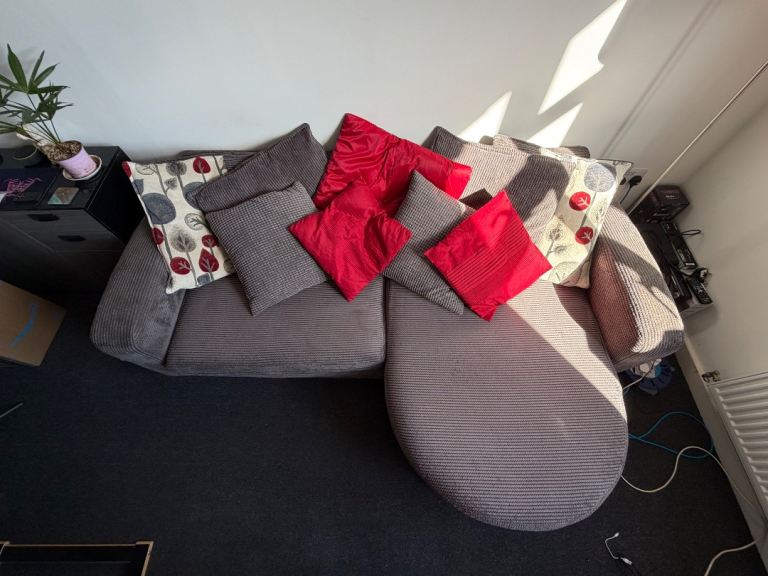 3-4 Seater Grey Fabric DFS Sofa with built in foot rest