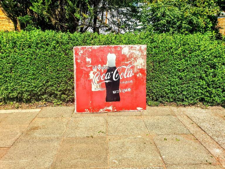 Retro metal Coca-Cola sign