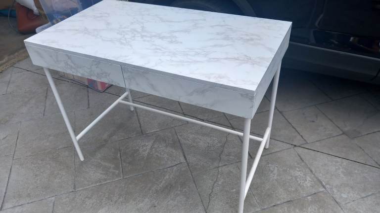 White marble effect desk.