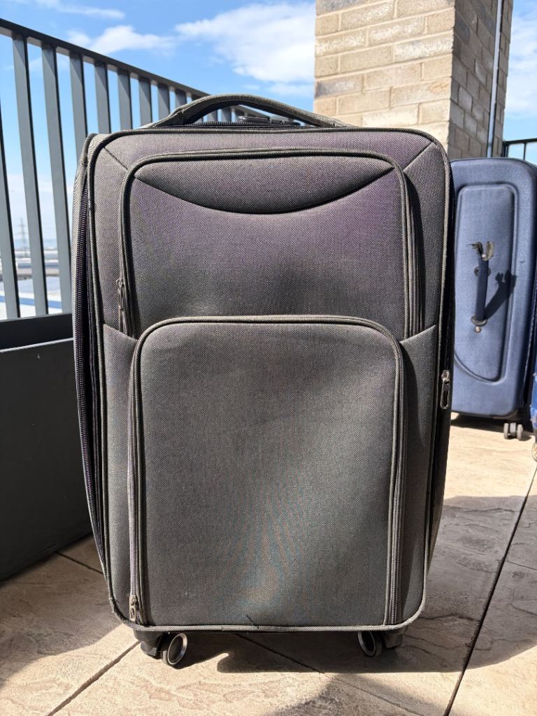grey soft-shell suitcase on 360-degree wheels medium size