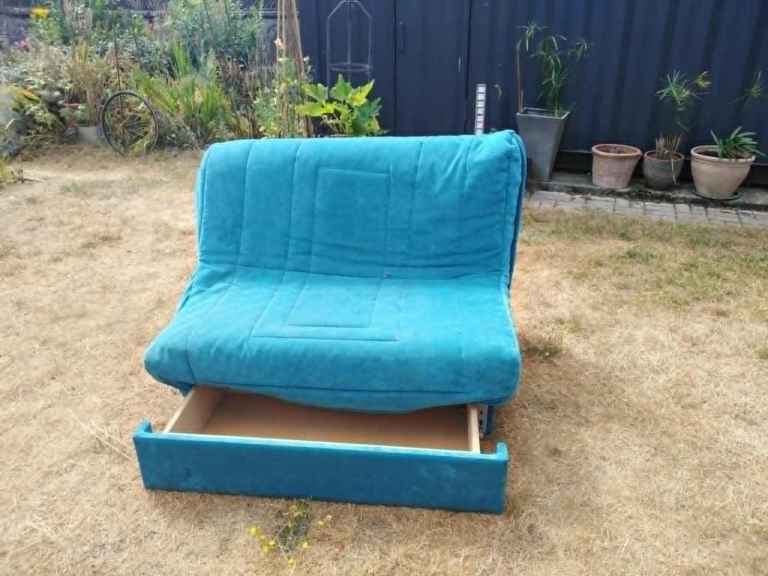 Compact Blue Sofa Bed with Storage Drawer – Good Condition