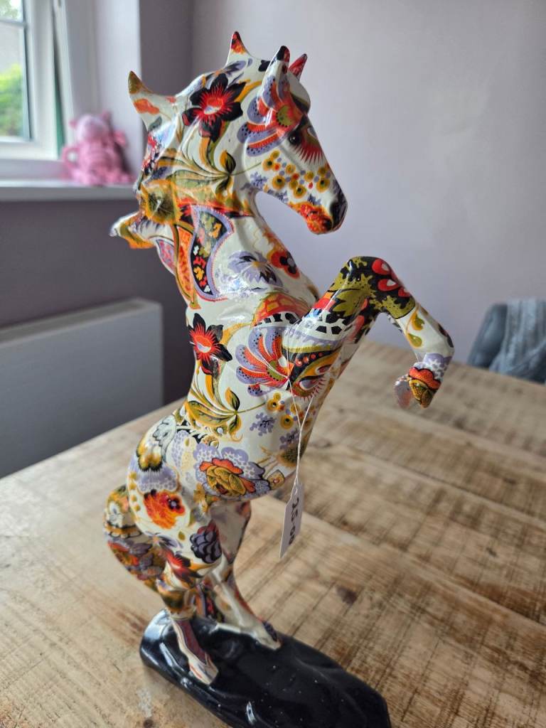 Floral paisley graffiti rearing horse.
