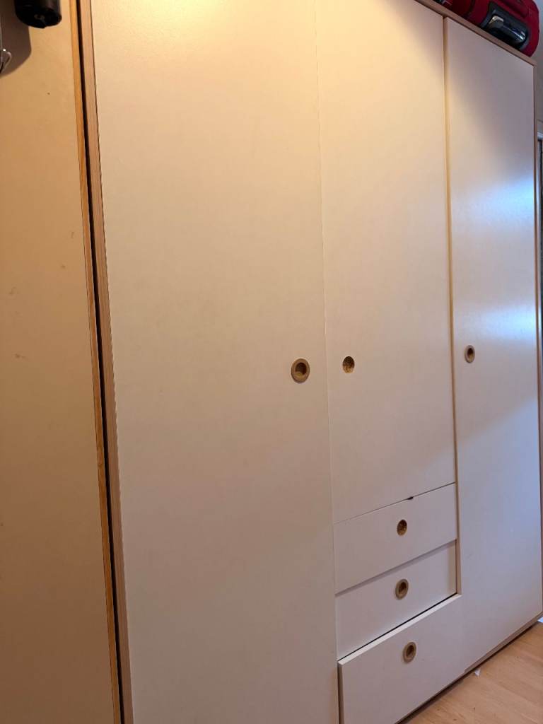 Wardrobe with three doors