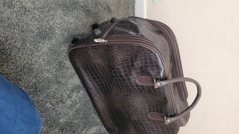 Large overnight type travel bag with wheels  to pull along