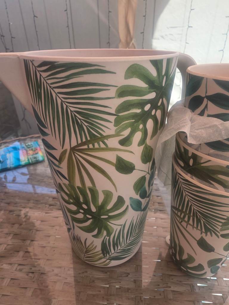 A new 5 piece plastic bamboo style cream with green leaf design serving jug and 4 beaker set. 