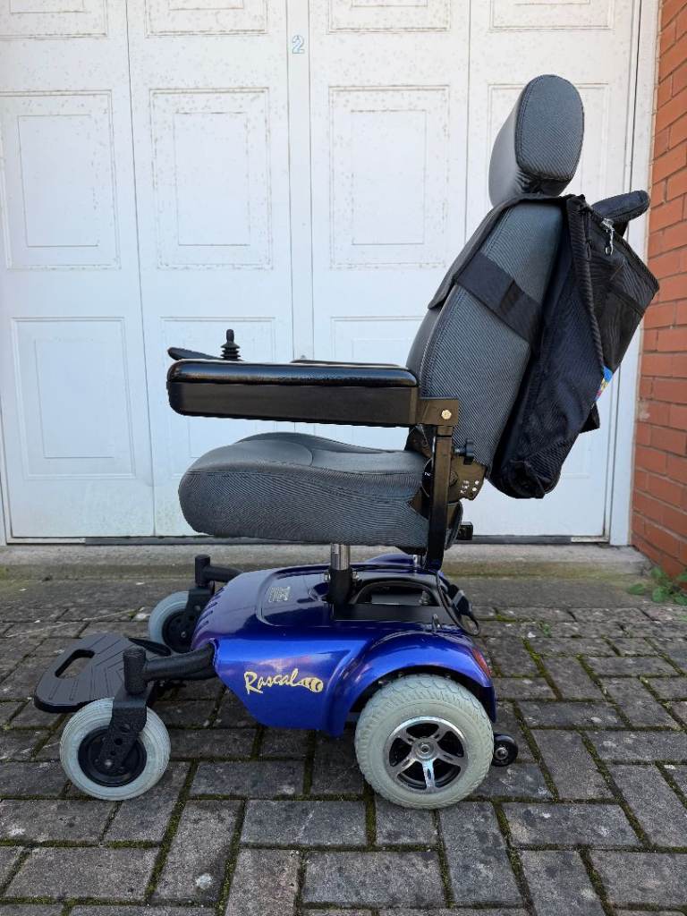 Mobility power chair, Electric wheelchair Rascal 320. New batteries. I ...