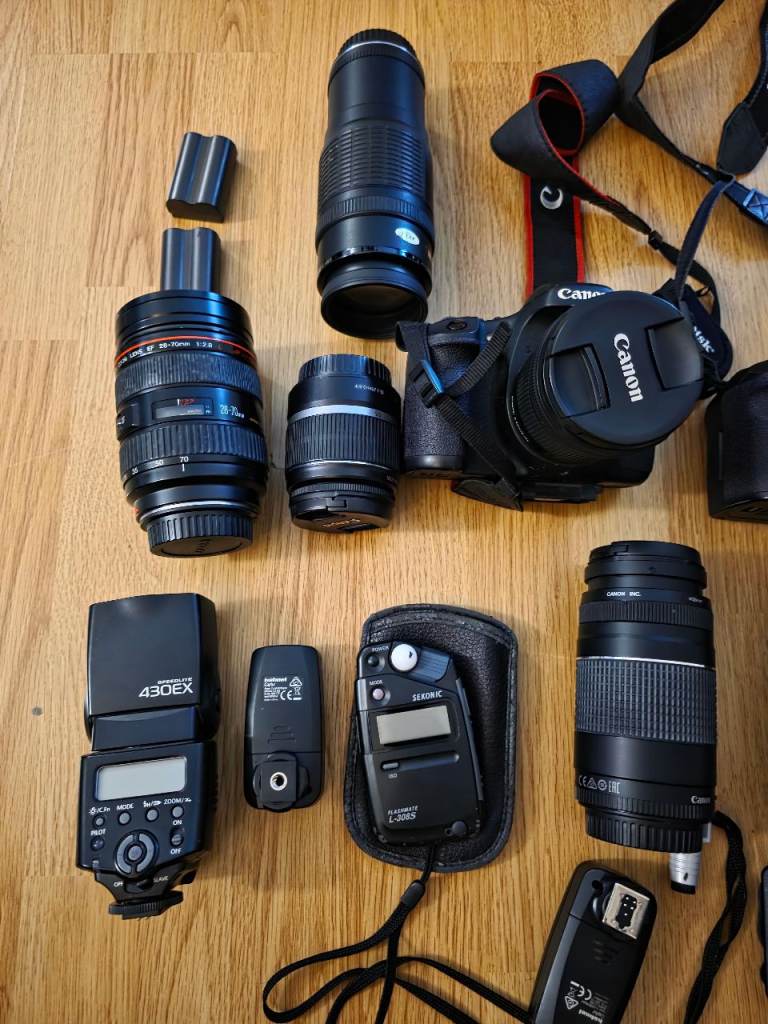 2 canon cameras with loads of accessories.