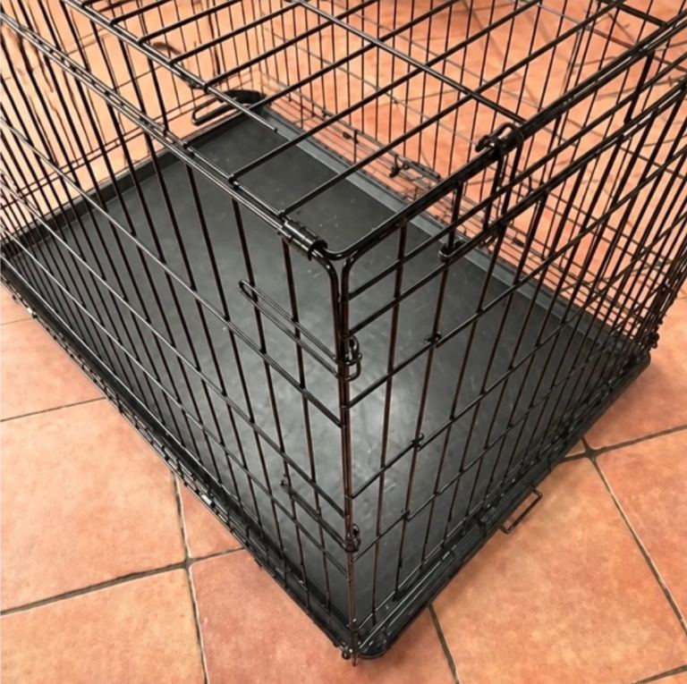 Large dog cage for indoor use.