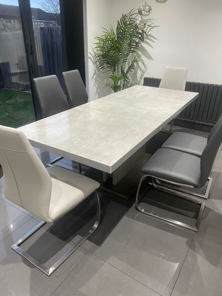 Elegant grey dining table and chairs