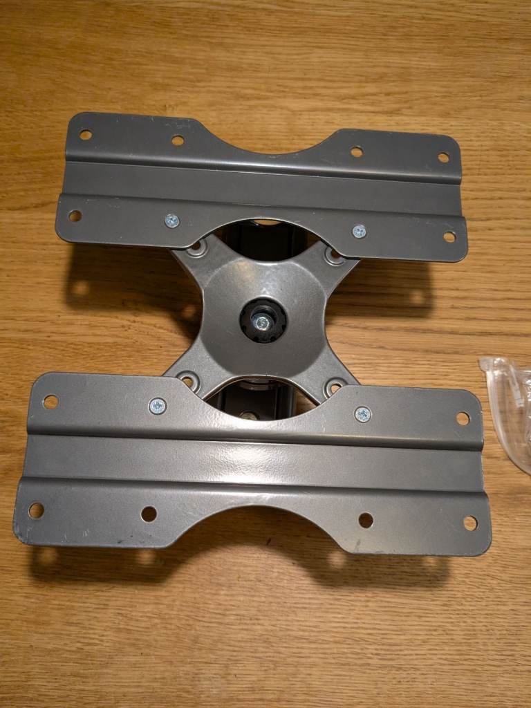 Very strong TV wall mount grey with cable clip.