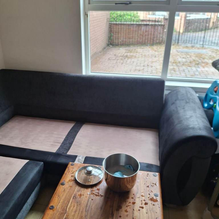 Corner sofa with footstool