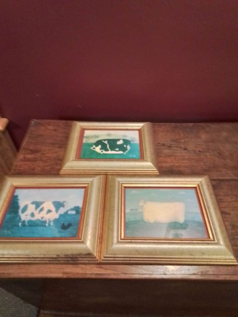 Trio of gold framed animal prints 