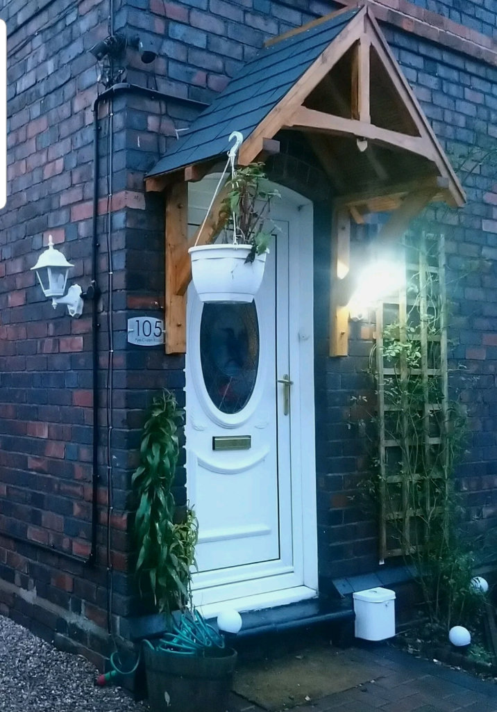 Wooden door canopy rain shelter