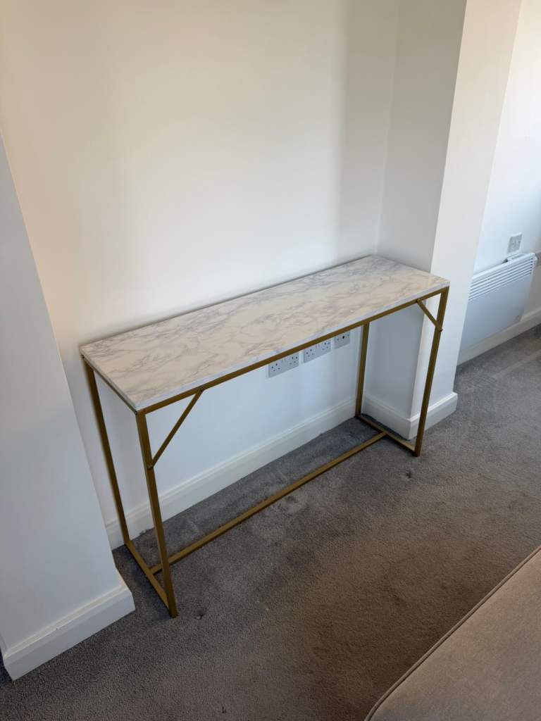 Laura James marble effect console table 