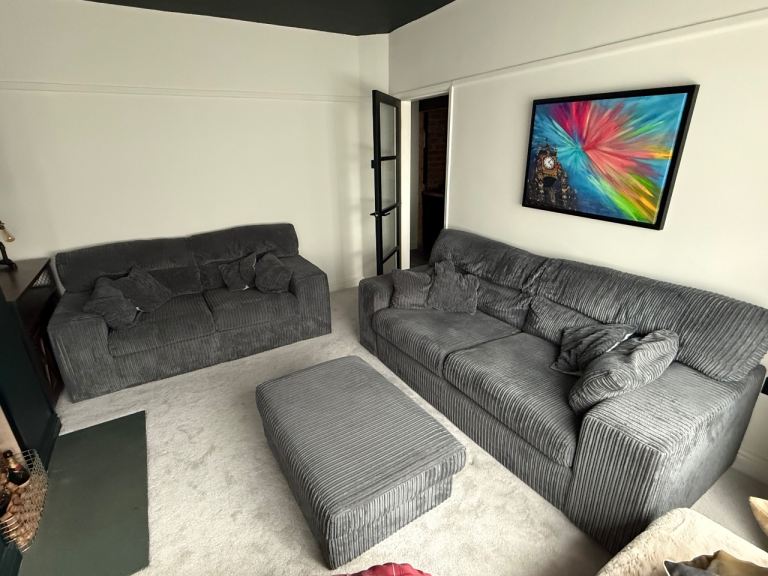 Jumbo cord grey sofas and footstool