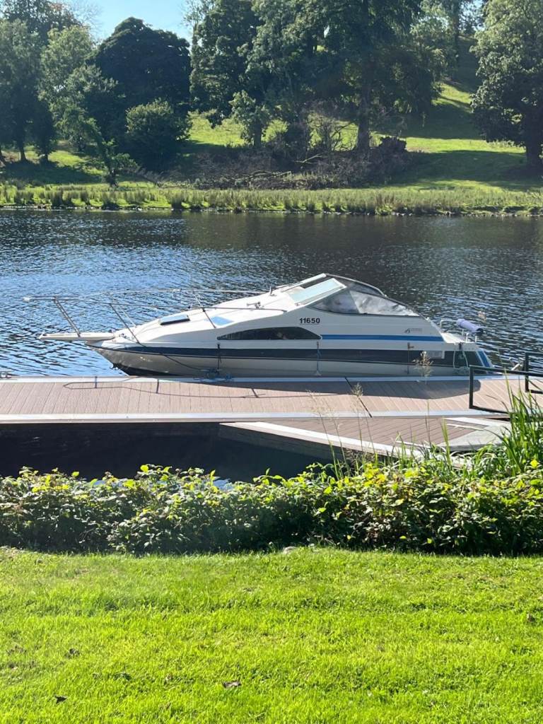 Speed boat, cruiser, blue and white, includes trailer