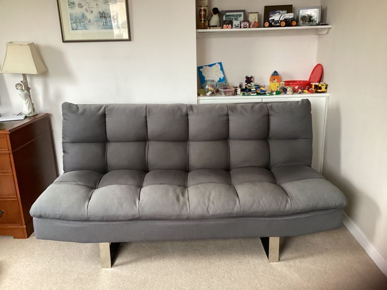 Click clack sofa bed in grey.