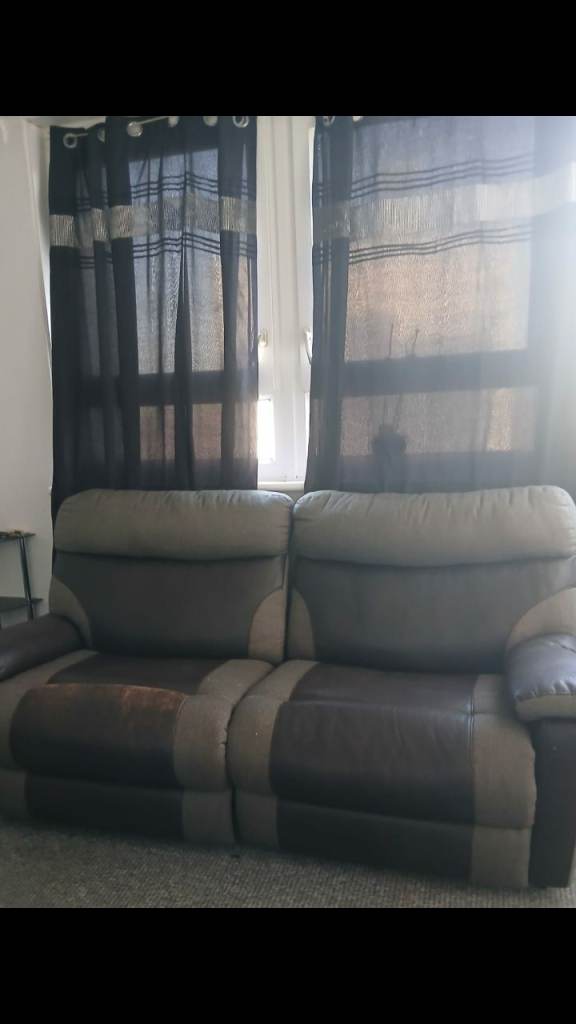2 reclining leather sofa with side pockets  .BARGAIN. 
