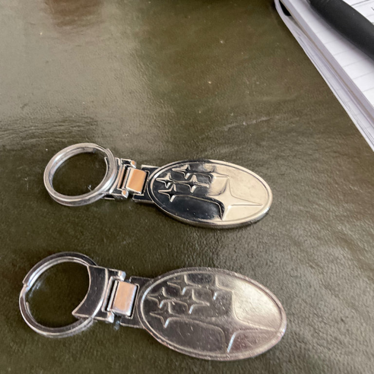 Pair genuine Subaru key rings one not used 