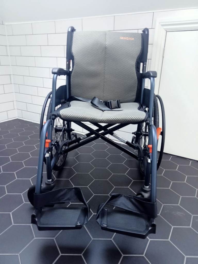 Lightweight foldable wheelchair. As new