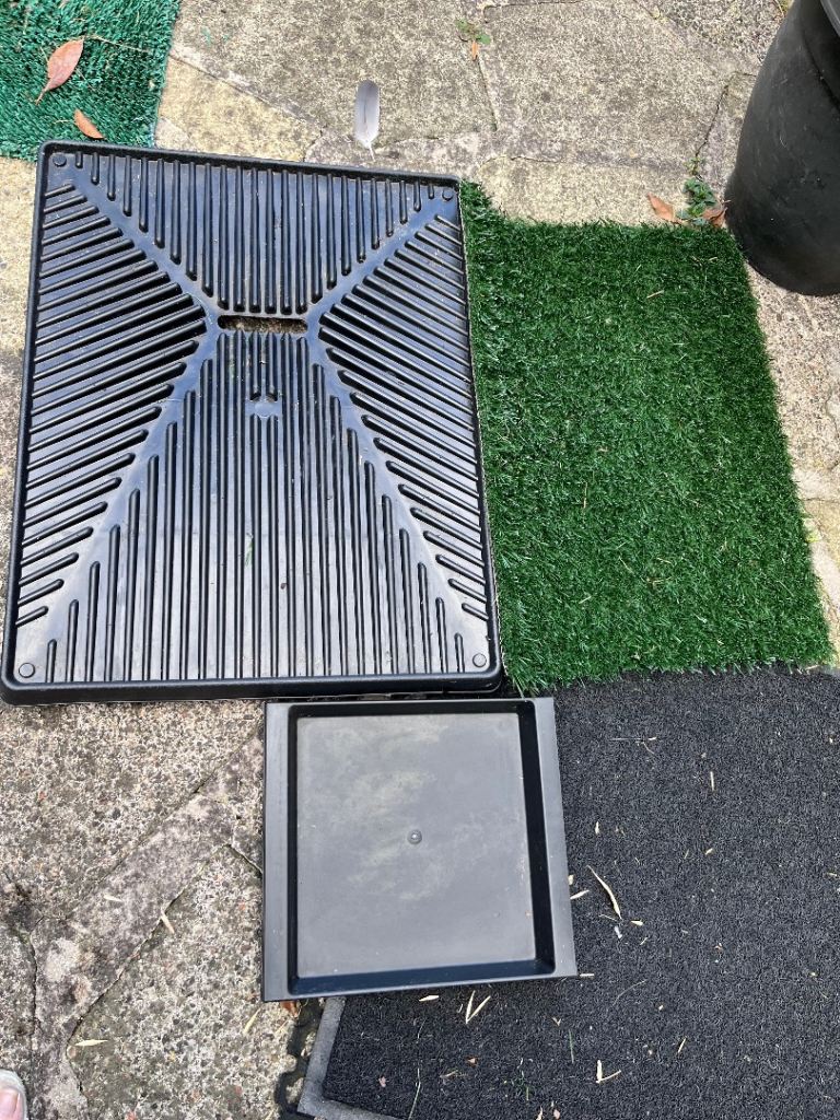 Dog training tray with faux grass & pull out tray cost £39.99 