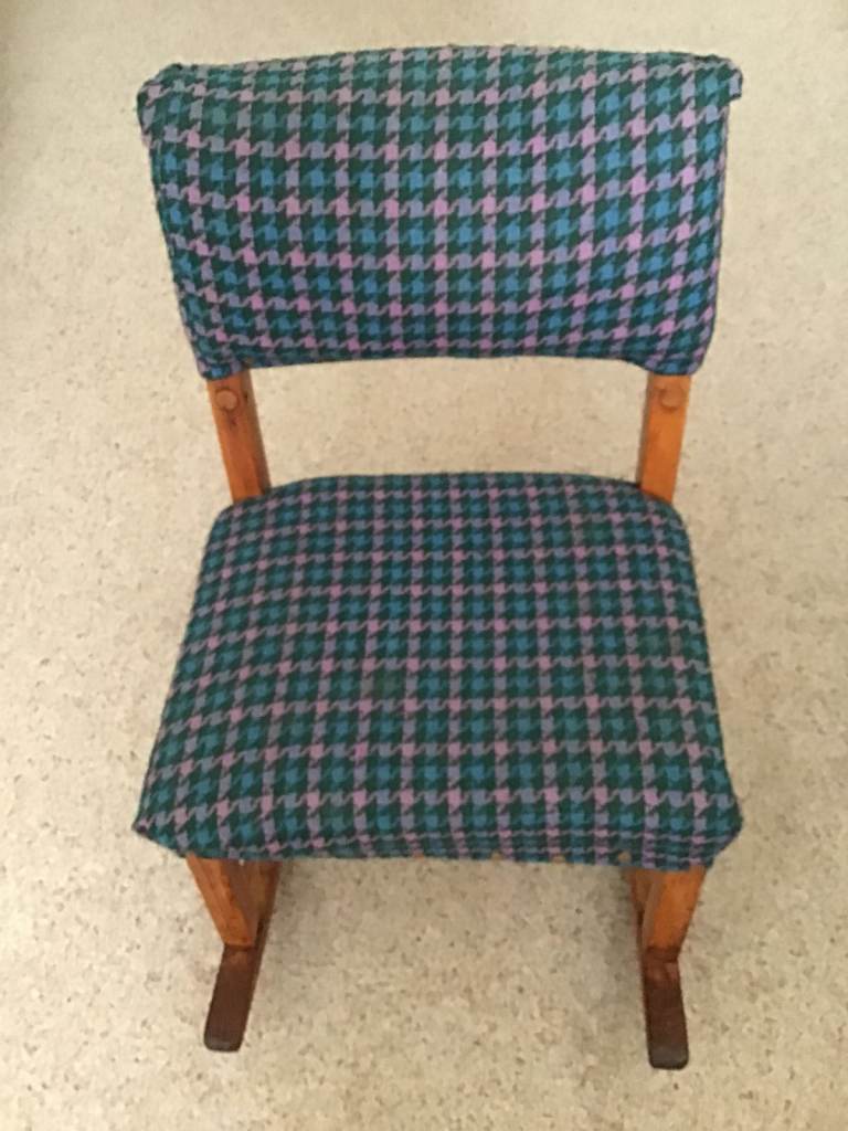CHILD’S VINTAGE ROCKING CHAIR.  UPHOLSTERED SEAT AND BACK