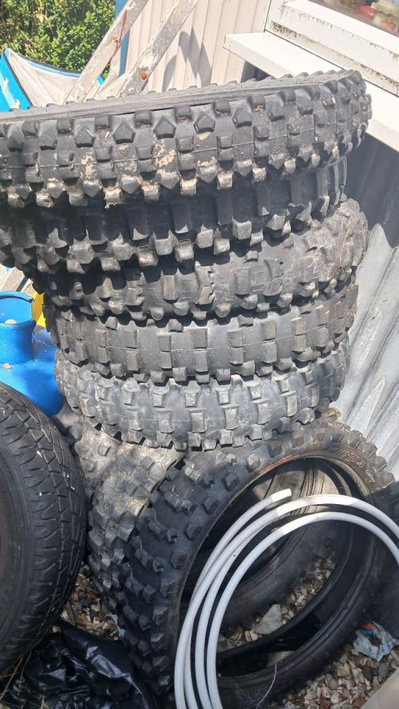 Stack of Used Bike Tyres – Mixed Condition