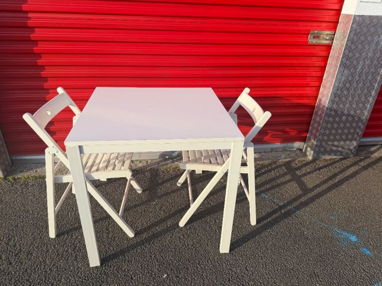 Small dinning table with two foldable chairs 