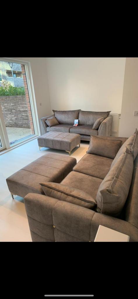 4 seater & 3 seater Grey Sofa with 2 footstalls