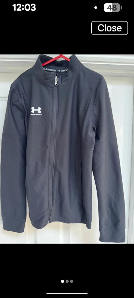 Under armour boys zipped jacket in black worn a couple of times but in a like new condition
